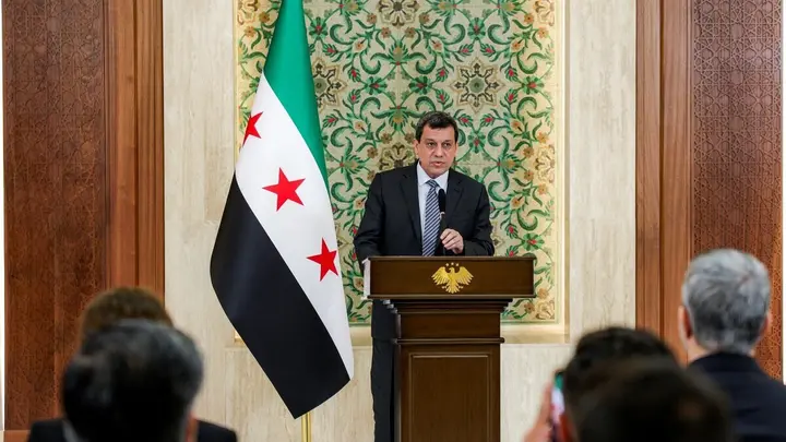 Mazloum Abdi, leader of the Kurdish-led Syrian Democratic Forces (SDF), speaks during a televised speech at the People’s Palace in Damascus on August 25, 2026.